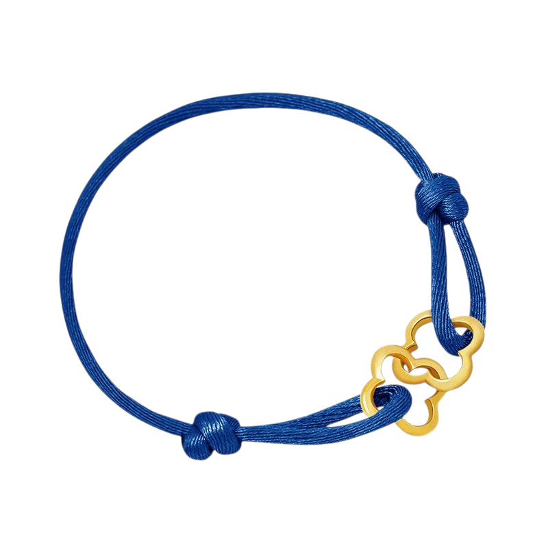 Aureliss geflochtenes Armband in Marineblau mit goldenem kleeblattartigem Anhänger und verstellbarem Knotenverschluss