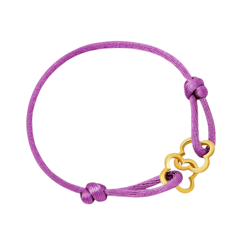 Aureliss geflochtenes Armband in Lila mit goldfarbenem kleeblattartigem Anhänger und verstellbarem Knotenverschluss